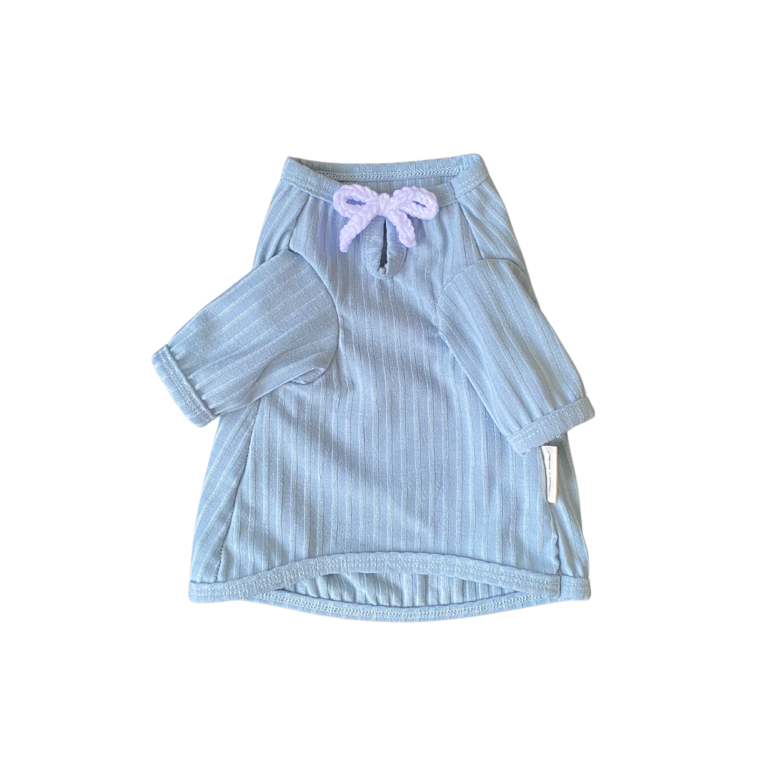 Light blue striped dress with a bow on a white background