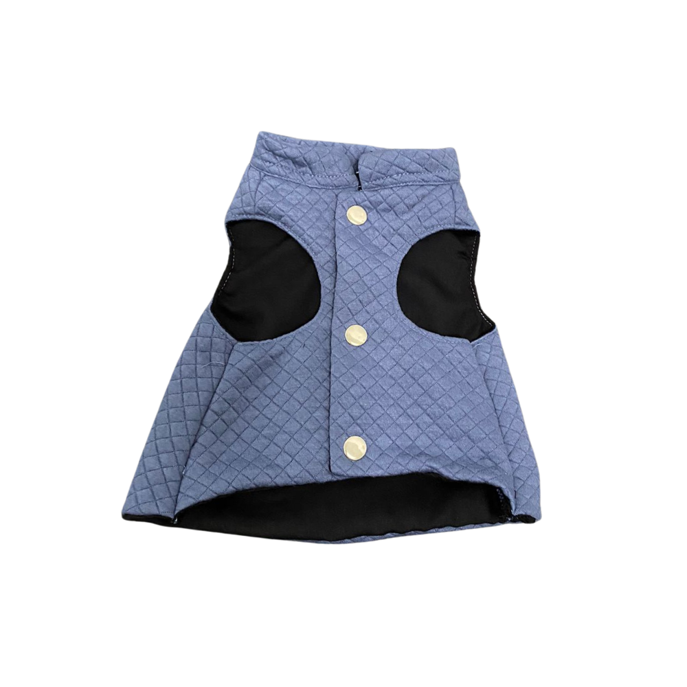 Blue quilted dog coat with black patches on a white background