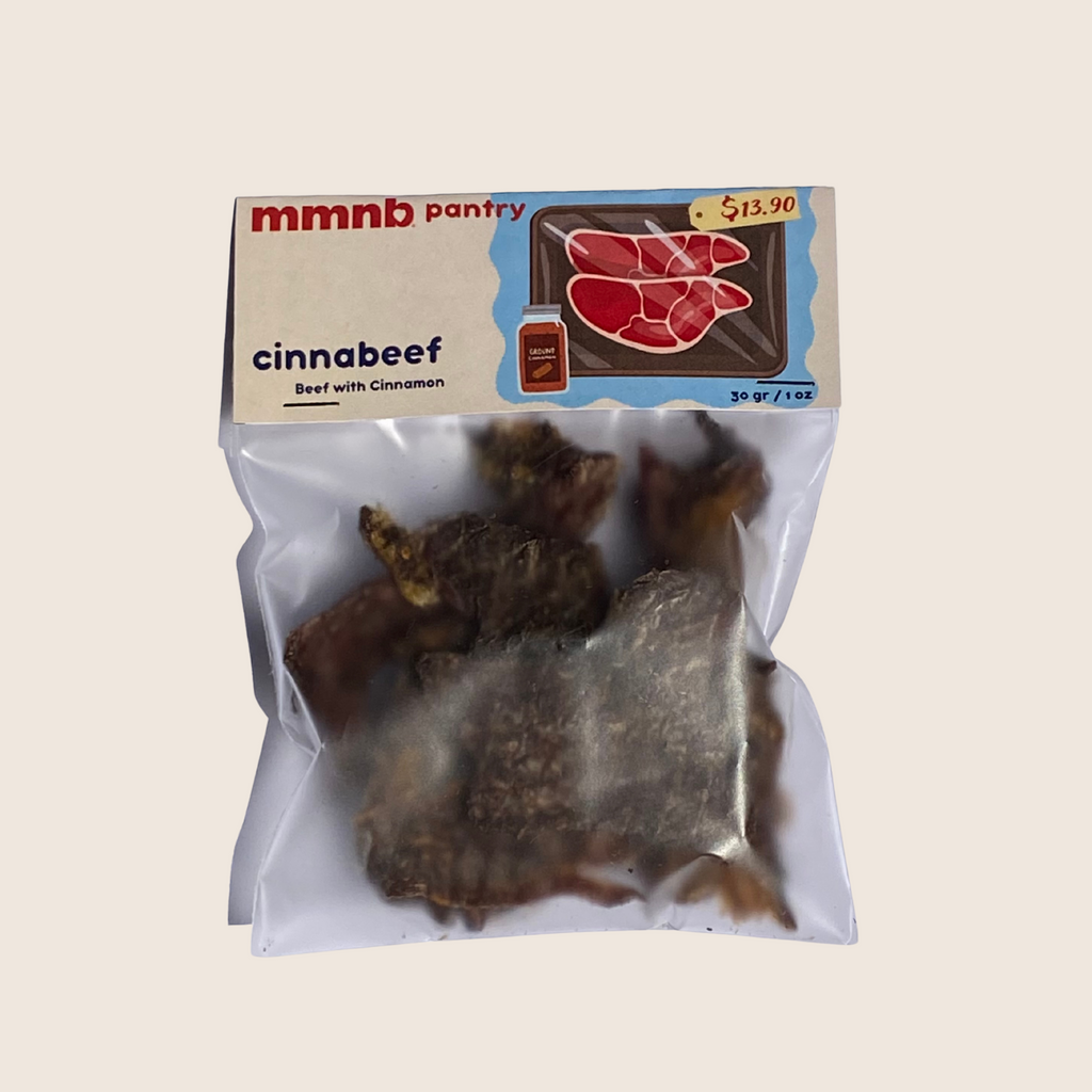 Packaged product labeled 'cinnabeef' with cinnamon flavor on a beige background
