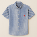 Blue and white striped shirt with a red heart on a beige background