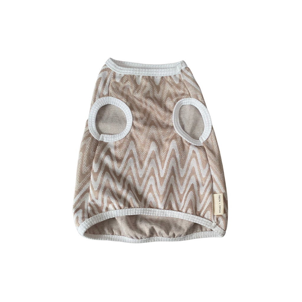 Dog sweater with zigzag pattern and circular mesh holes on a white background