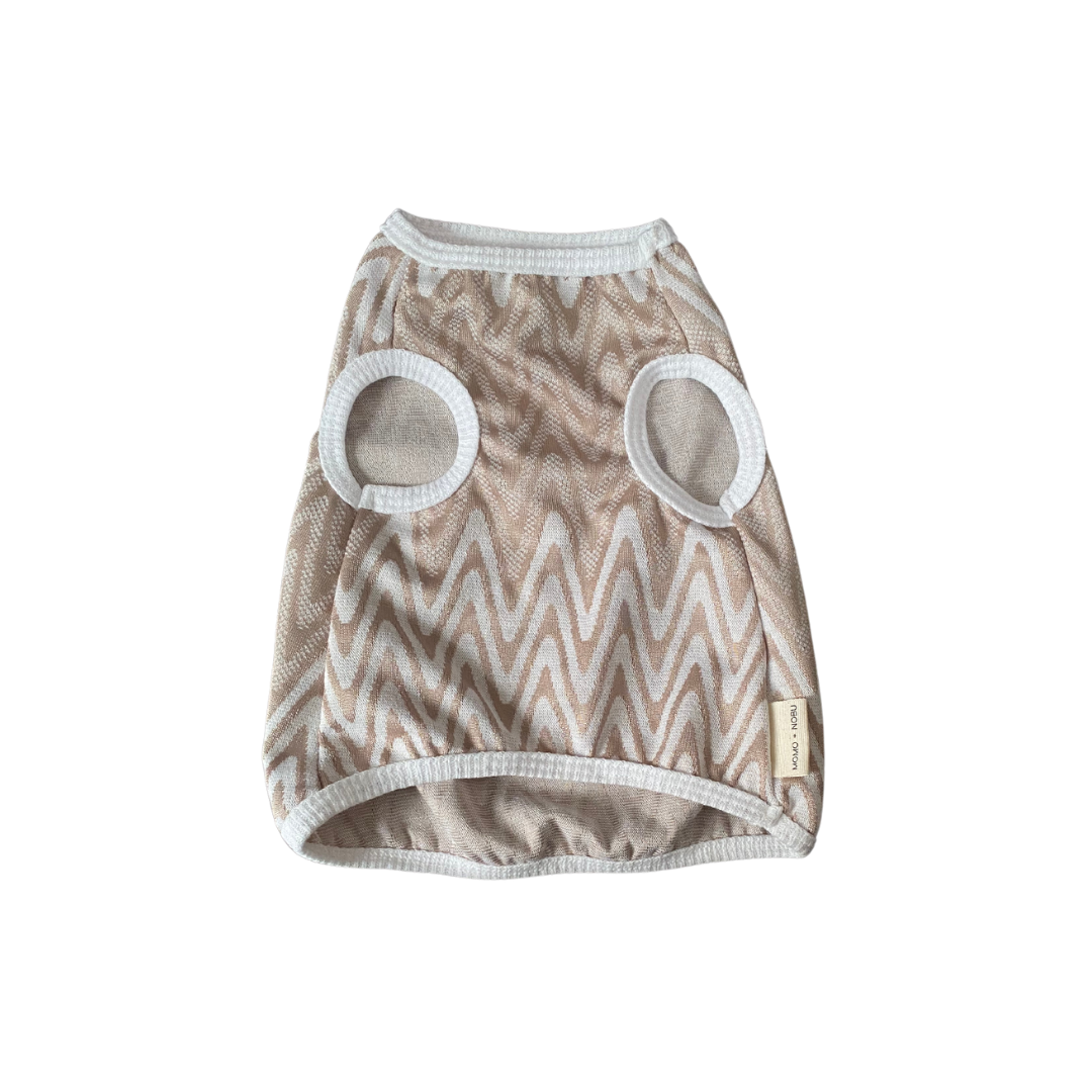 Dog sweater with zigzag pattern and circular mesh holes on a white background