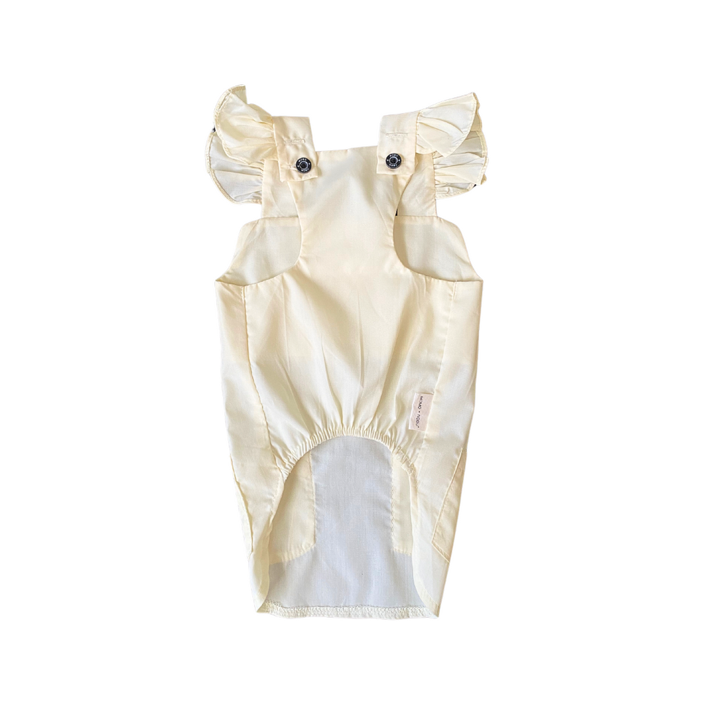 Beige baby romper with ruffled sleeves on a white background