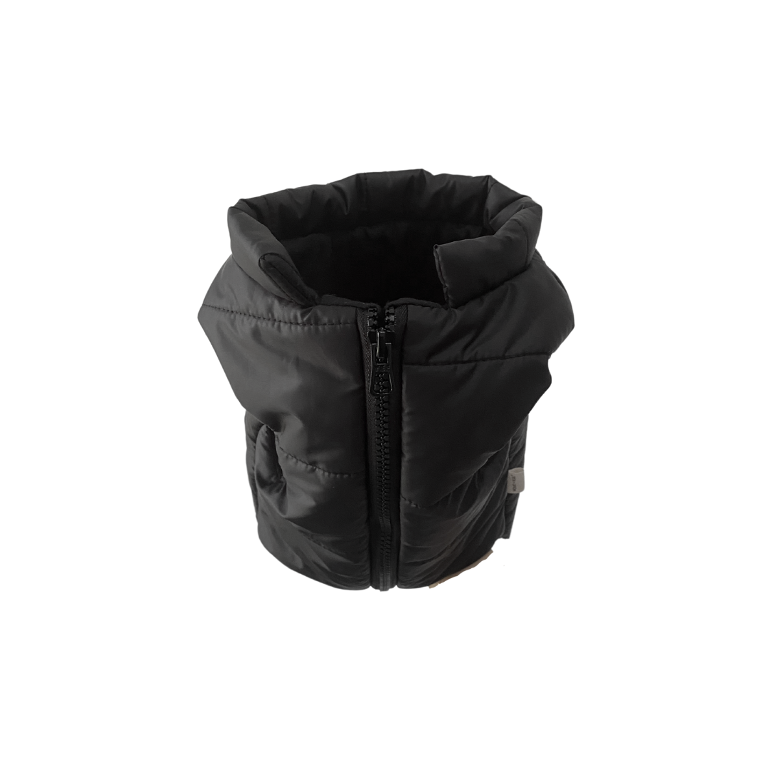 Black puffer vest on a white background