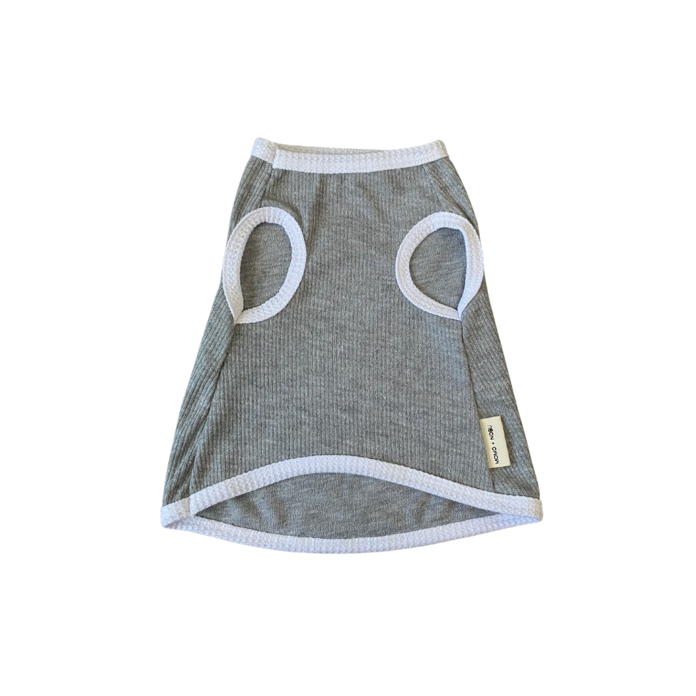 Gray pet dress with circular cutouts on a white background