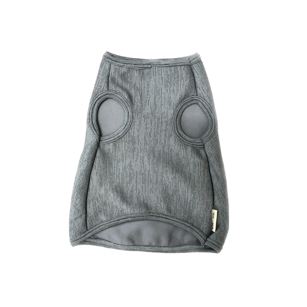Gray dog sweater with circular patterns on a white background
