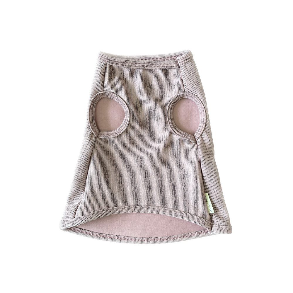 dog shirtin pink with circular cutouts on a white background