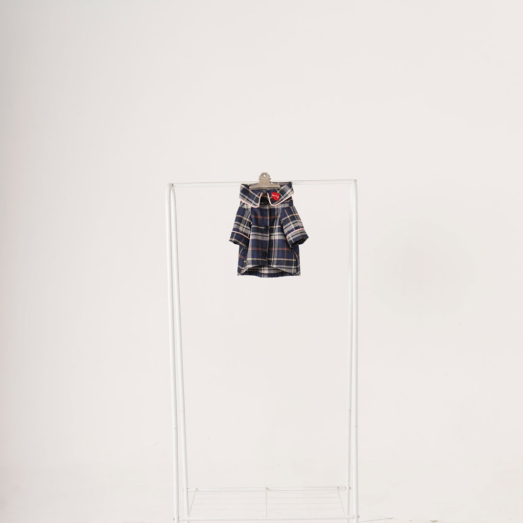 Plaid shirt hanging on a white door