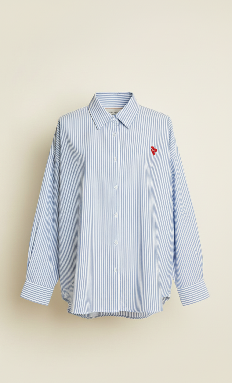 Blue striped shirt with a red heart emblem on a beige background