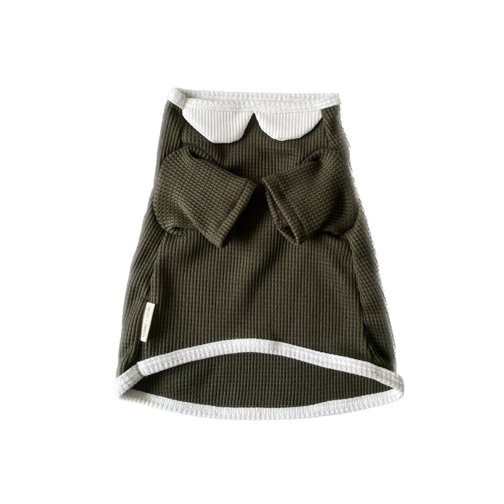 Green textured skirt with white trim on a white background